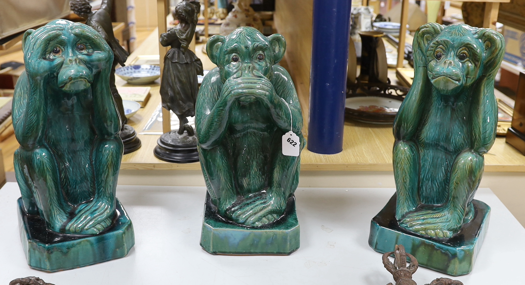 A trio of monkeys, Hear no evil, See no evil, Speak no evil, green glazed earthenware, approximately 52cm high